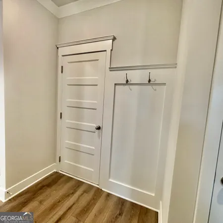 a bathroom with a toilet and a bath tub