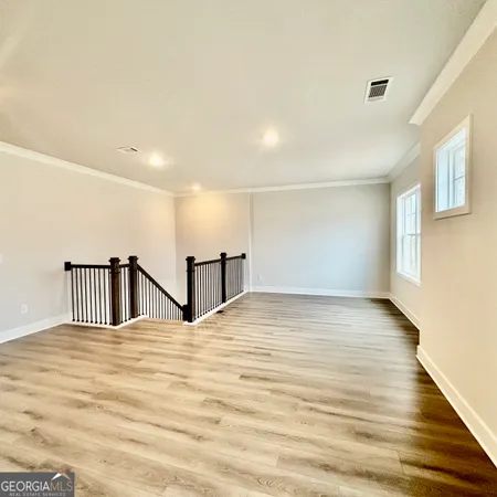 a front view of a house with a yard table and chairs