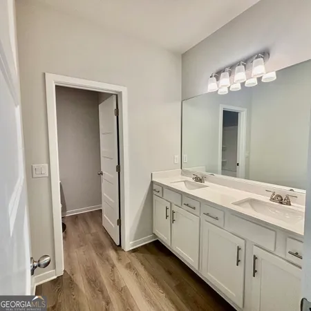 an aerial view of a house with swimming pool and outdoor seating