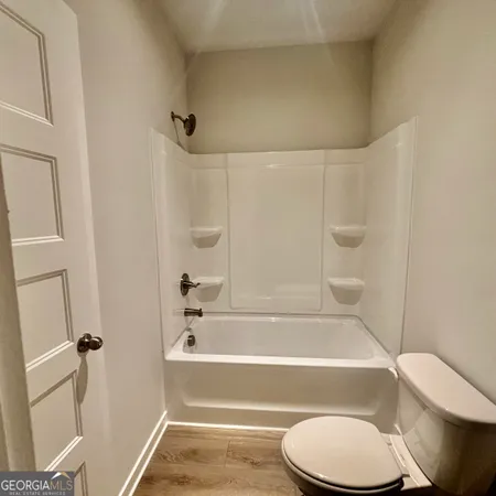 a view of a lake with couches in the patio