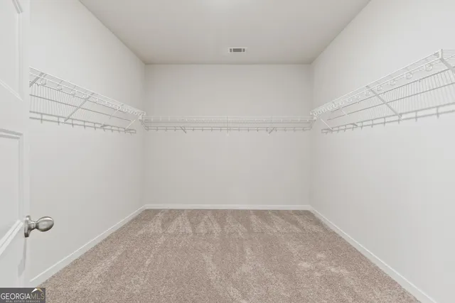 a front view of a house with a yard table and chairs