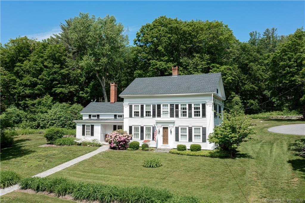 401 Riverton Road Hartland, CT 06065 - Photo 1 of 1 a front view of a house with a garden