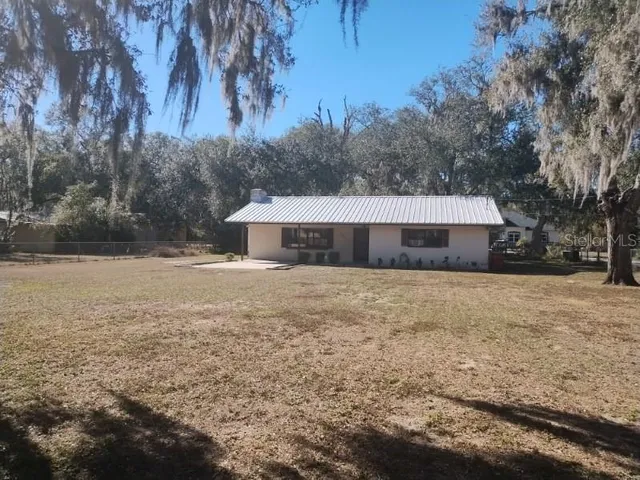 a front view of house with a yard