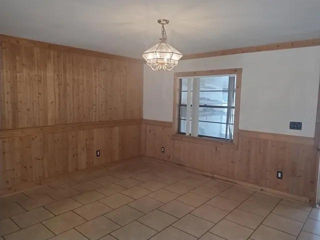 a kitchen with a sink a stove a refrigerator and cabinets