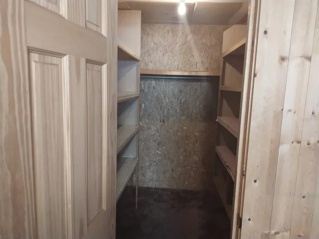 a bathroom with a tub and shower