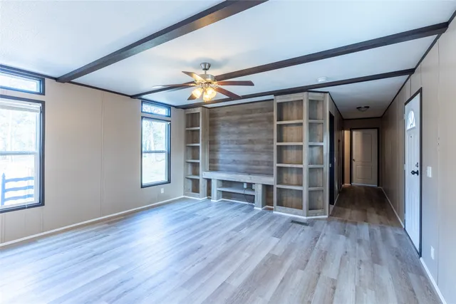 a kitchen with a sink and wooden cabinets