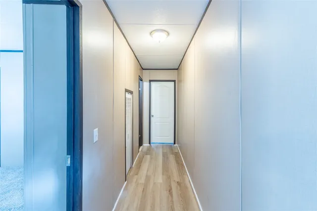 a view of an empty room and a window