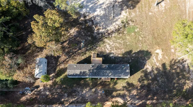 a view of a park with large trees