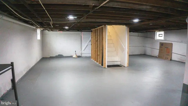 a view of empty room with wooden ceiling