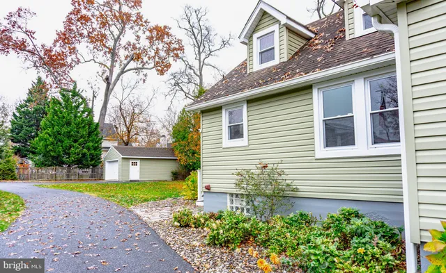 a house that has a tree in front of the house
