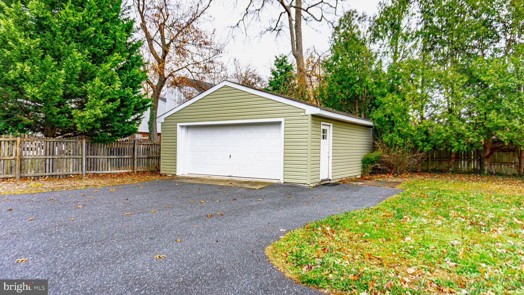 213 East Chatsworth Avenue Reisterstown, MD 21136 - Photo 20 of 23 a front view of a house with a yard and garage