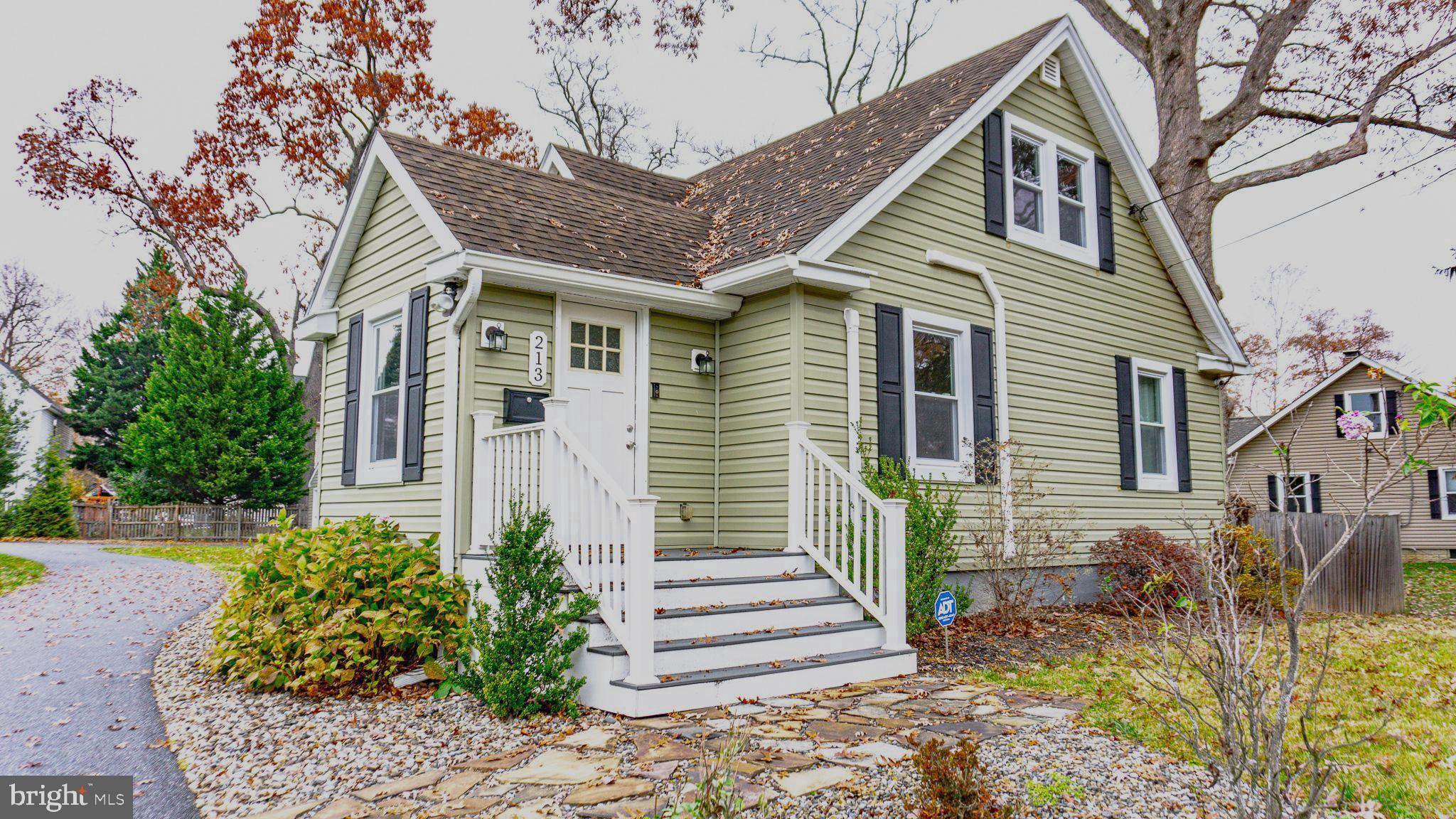 213 East Chatsworth Avenue Reisterstown, MD 21136 - Photo 2 of 23 a front view of a house with a garden
