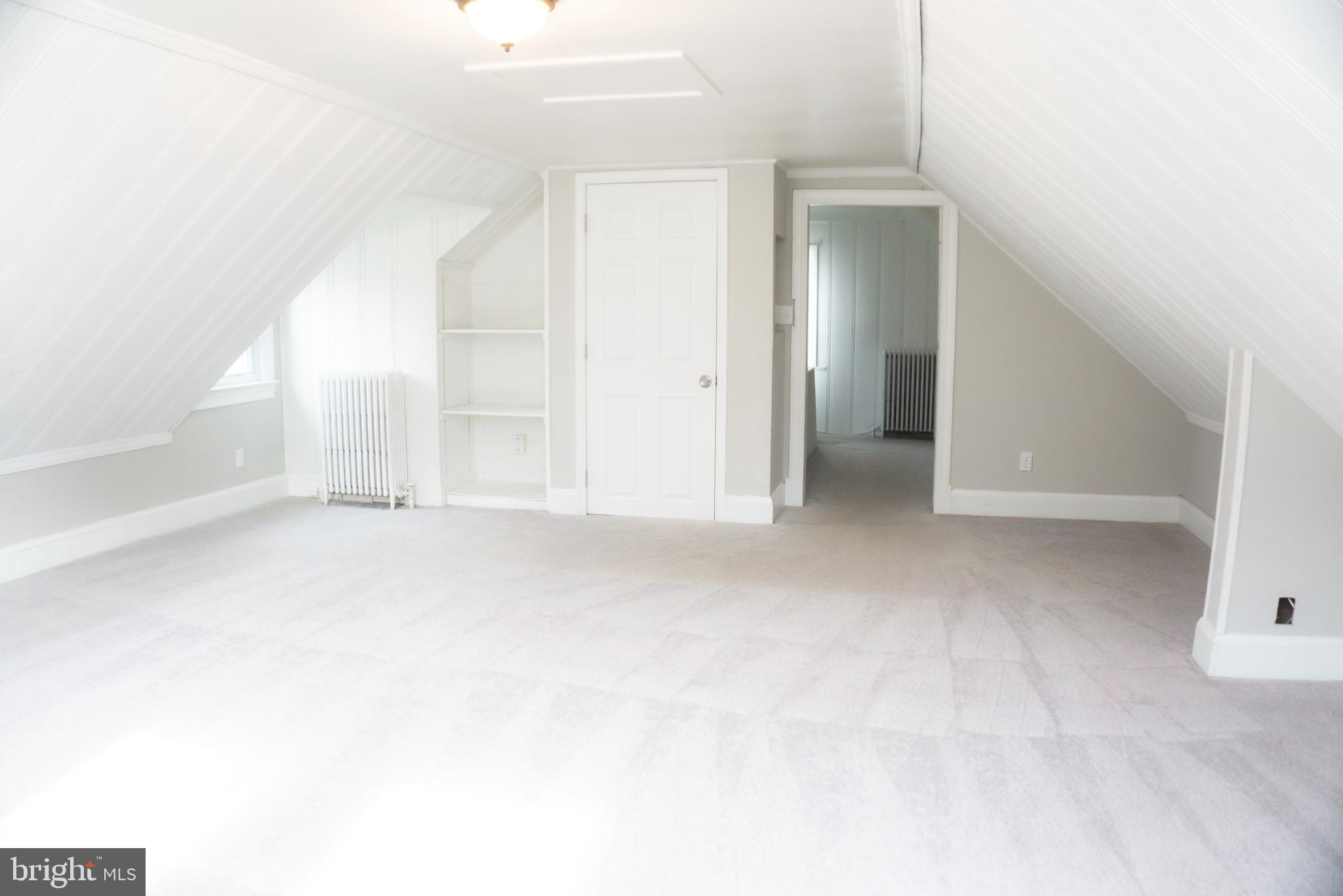 213 East Chatsworth Avenue Reisterstown, MD 21136 - Photo 6 of 23 an empty room with windows