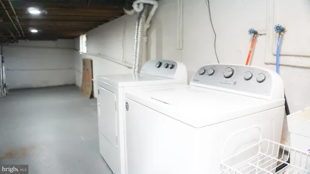 a utility room with dryer and washer