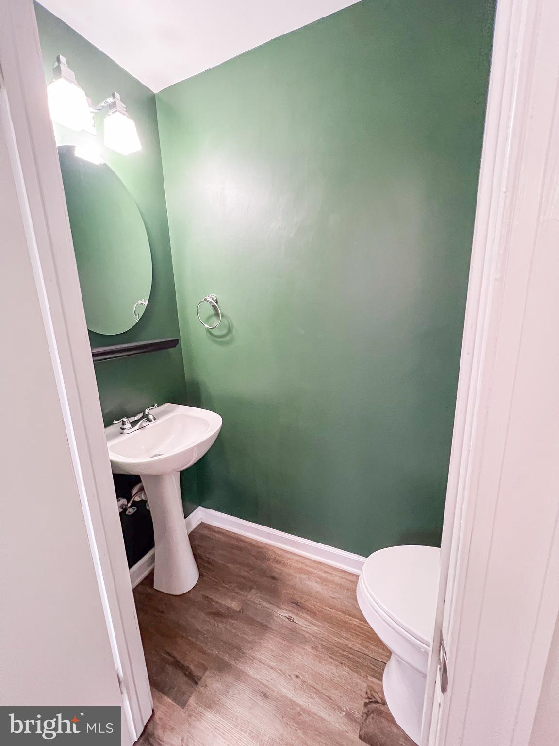 213 East Chatsworth Avenue Reisterstown, MD 21136 - Photo 8 of 23 a bathroom with a sink and a mirror