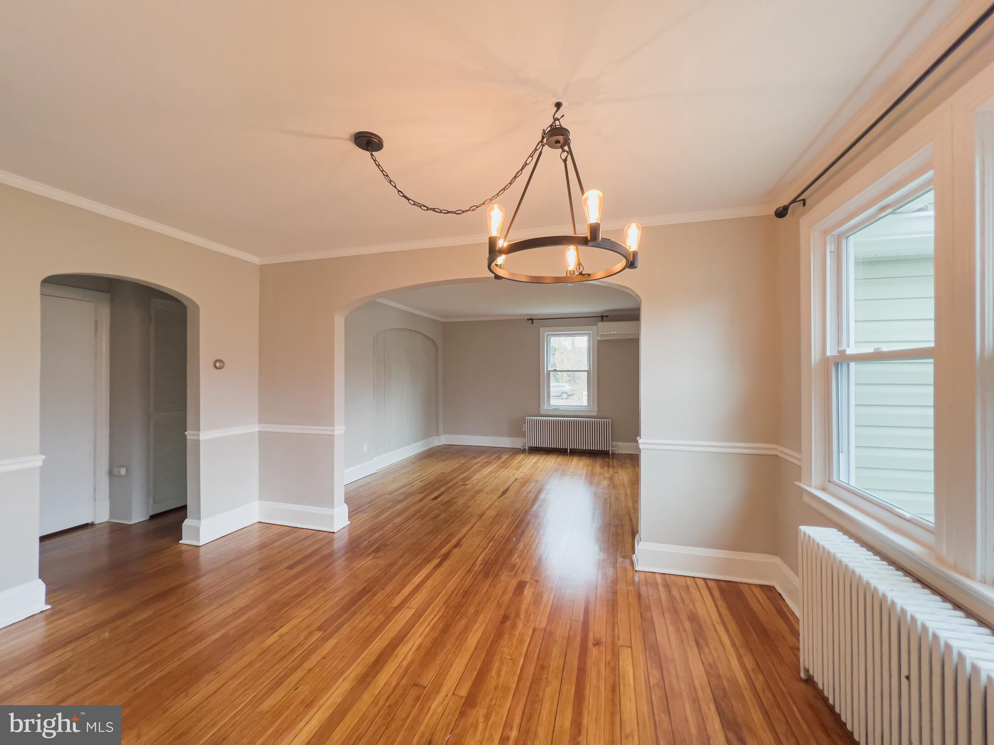 213 East Chatsworth Avenue Reisterstown, MD 21136 - Photo 9 of 23 a view of empty room with wooden floor and fan