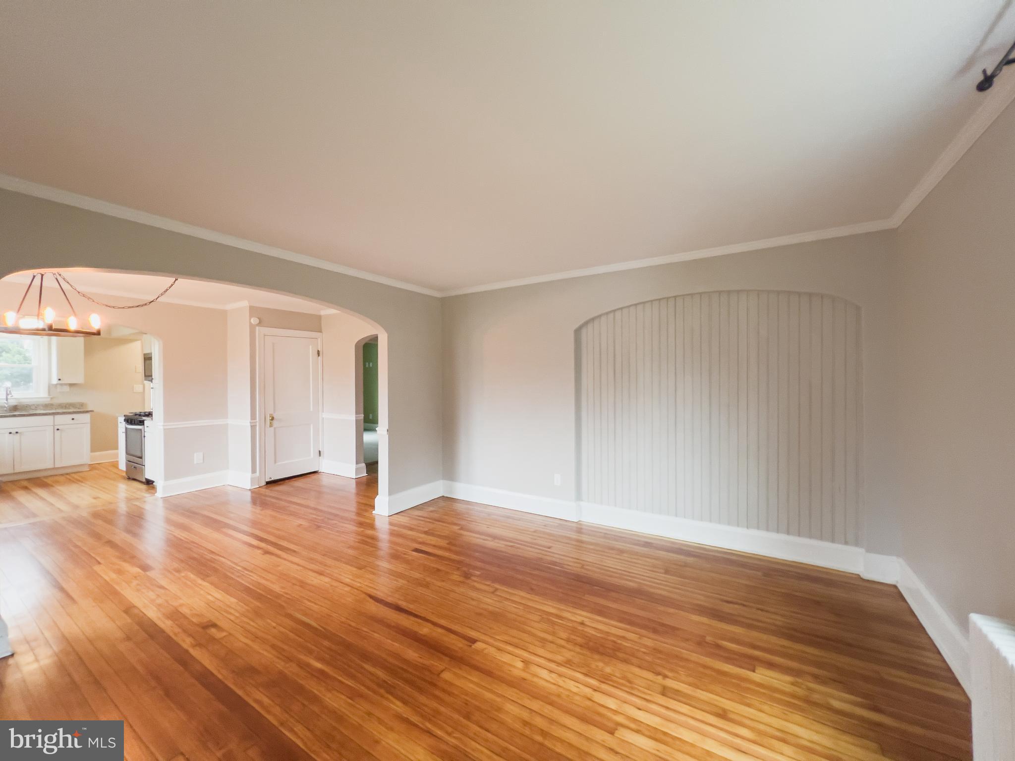 213 East Chatsworth Avenue Reisterstown, MD 21136 - Photo 10 of 23 a view of an empty room with wooden floor
