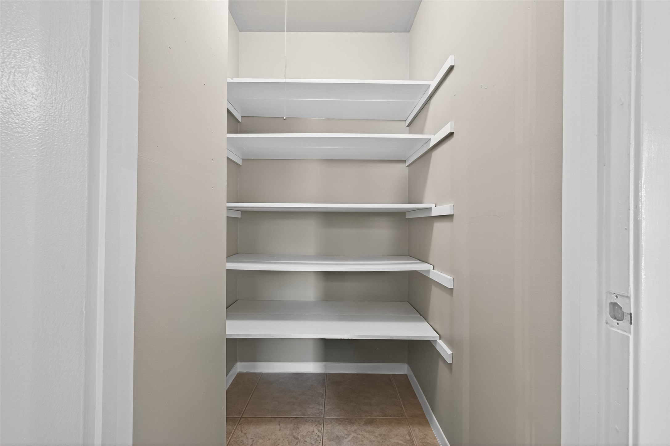 6230 Sunnygate Drive Spring, TX 77373 - Photo 17 of 40 a view of walk in closet with empty racks