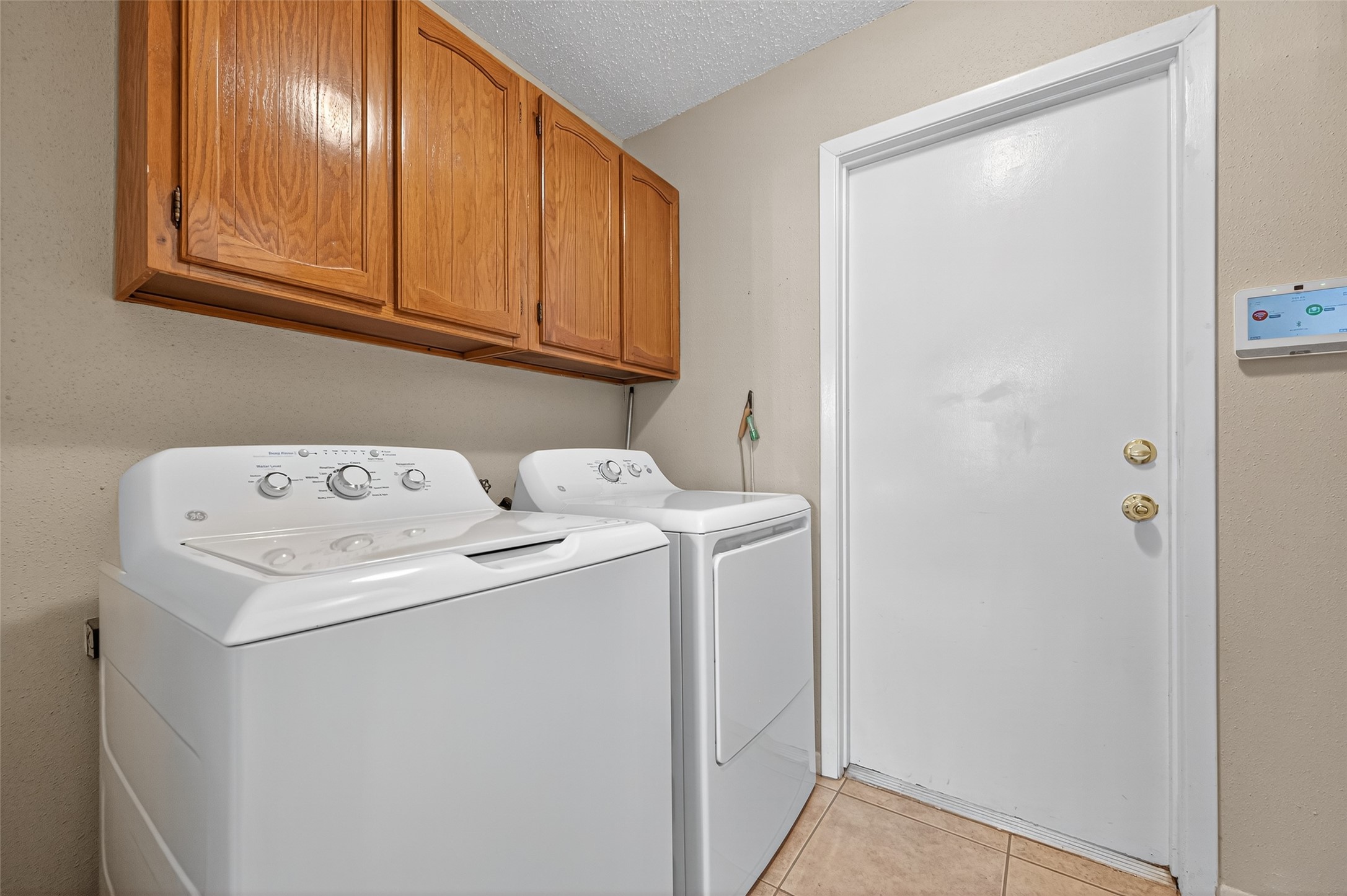 6230 Sunnygate Drive Spring, TX 77373 - Photo 19 of 40 a utility room with dryer and washer
