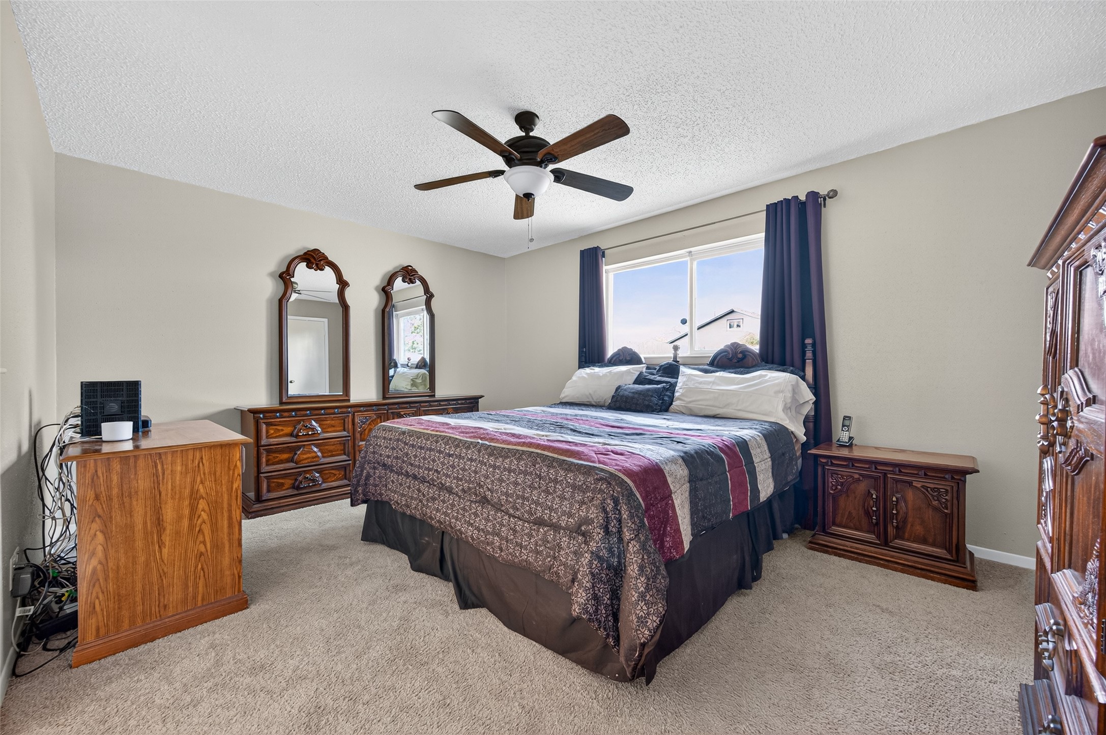 6230 Sunnygate Drive Spring, TX 77373 - Photo 20 of 40 a spacious bedroom with a bed and a chandelier