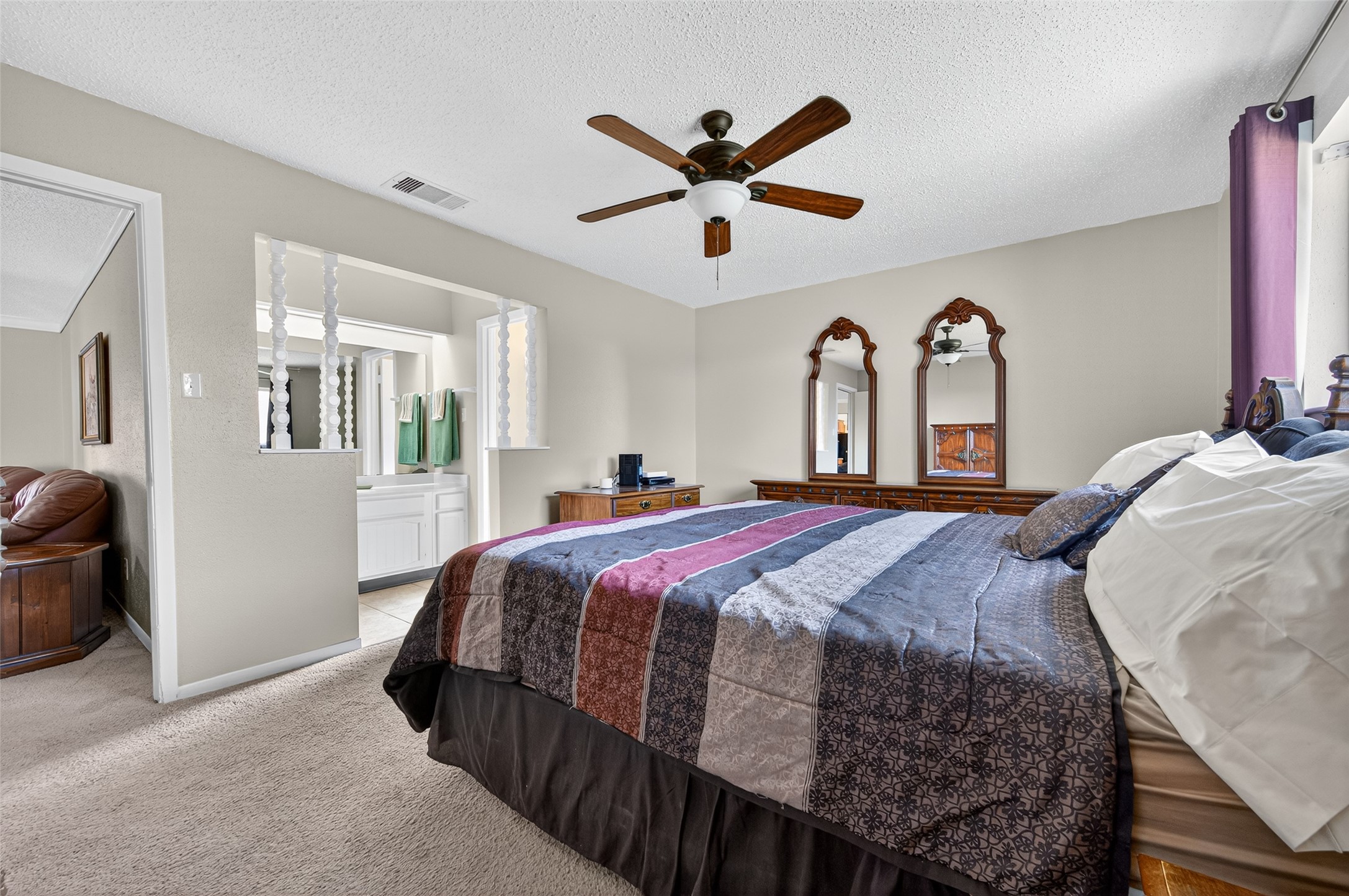 6230 Sunnygate Drive Spring, TX 77373 - Photo 21 of 40 a bed room with a bed and a chandelier