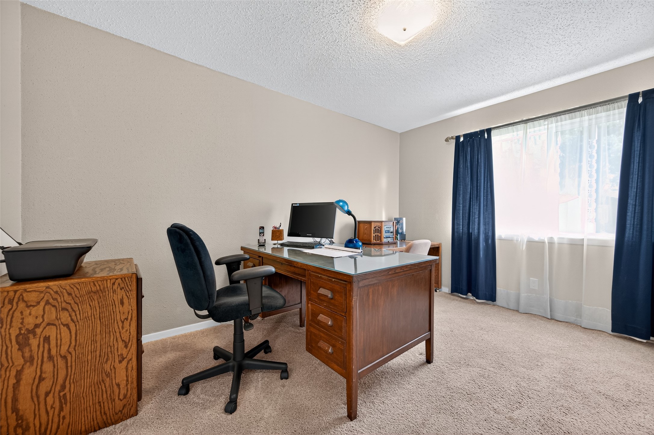 6230 Sunnygate Drive Spring, TX 77373 - Photo 27 of 40 a view of a workspace with furniture and a window