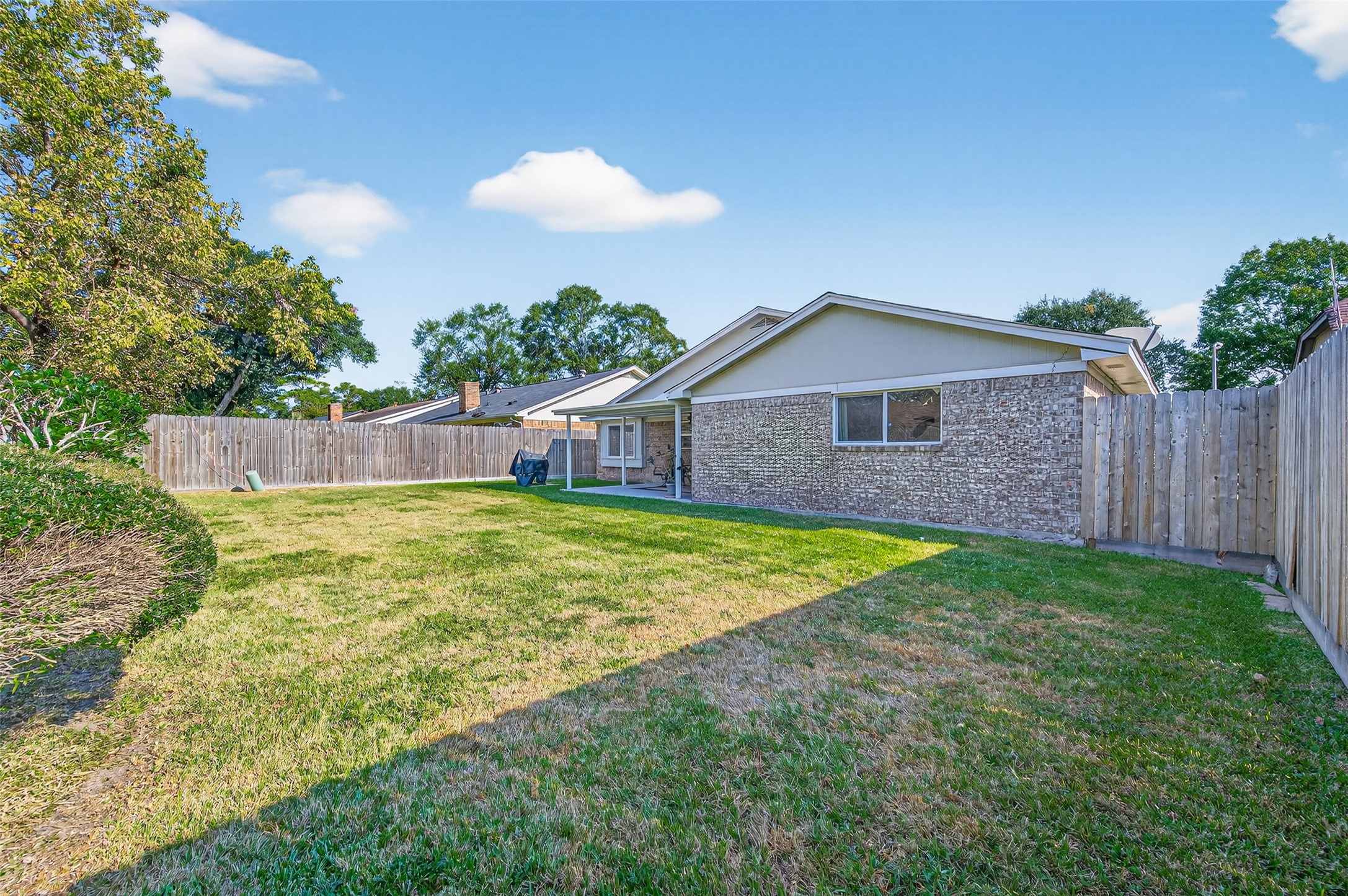 6230 Sunnygate Drive Spring, TX 77373 - Photo 38 of 40 a view of a backyard with a garden and entertaining space