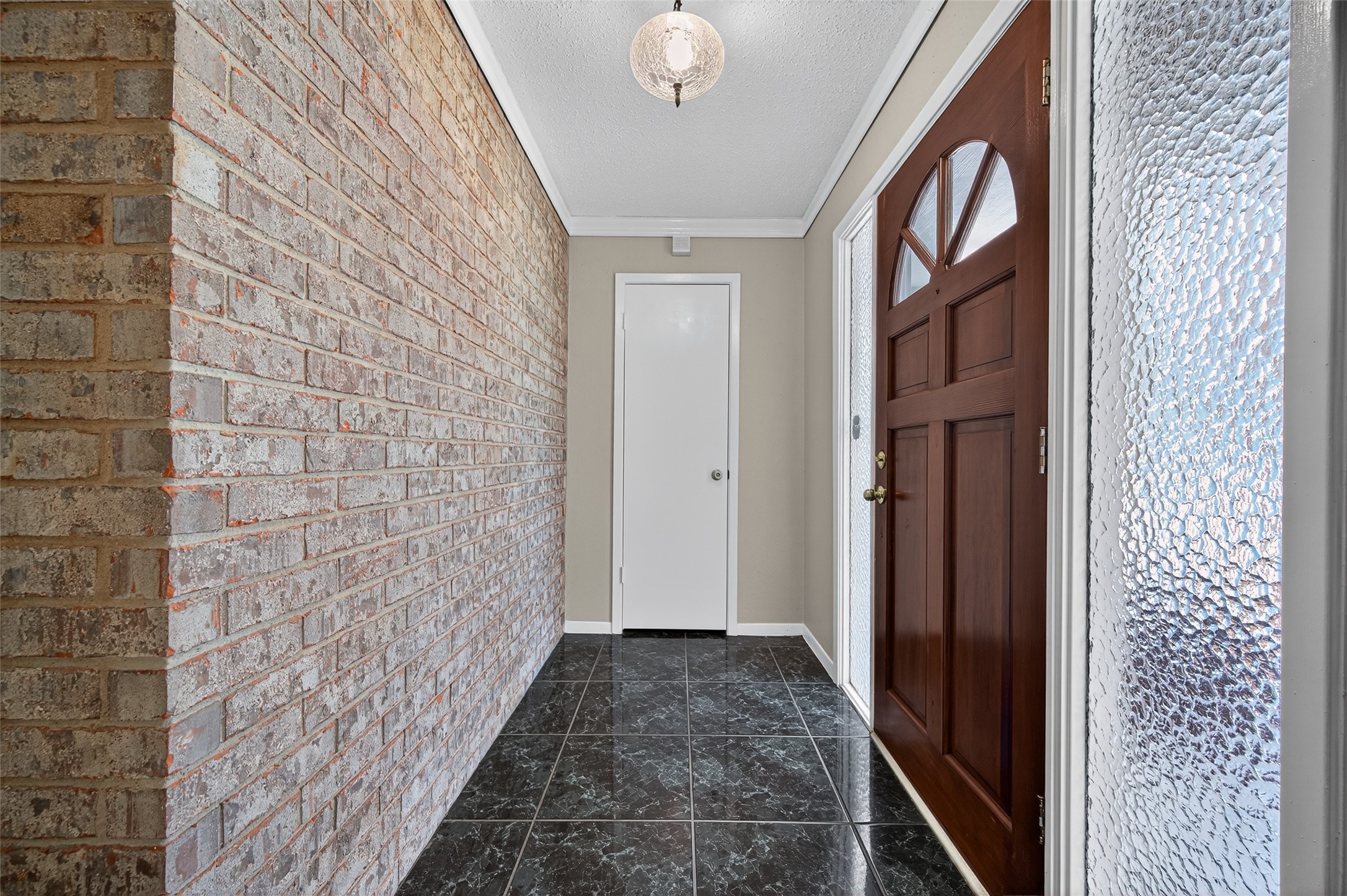 6230 Sunnygate Drive Spring, TX 77373 - Photo 5 of 40 a view of a brick house with a door