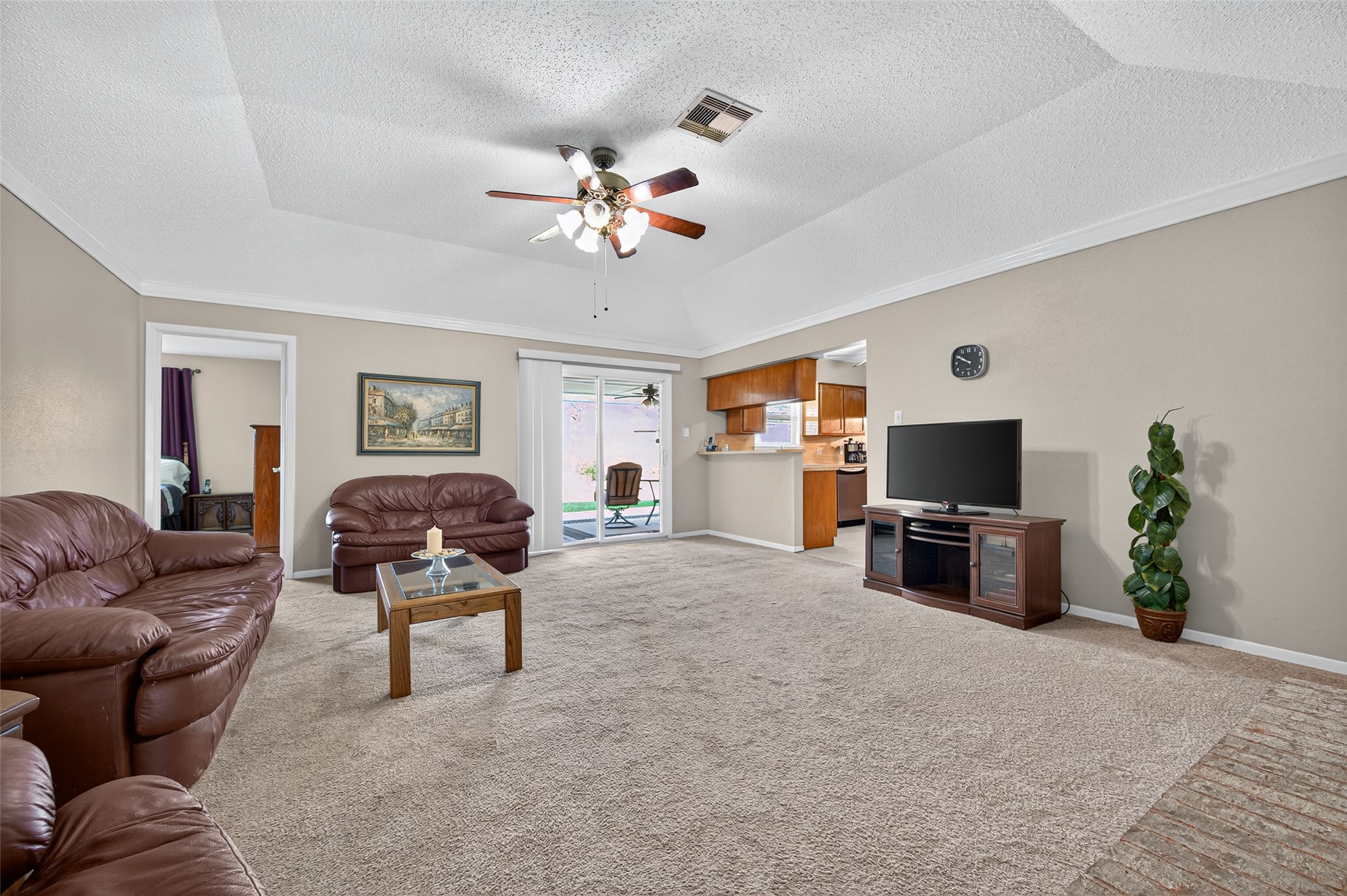 6230 Sunnygate Drive Spring, TX 77373 - Photo 6 of 40 a living room with furniture a dining table a lamp and a flat screen tv