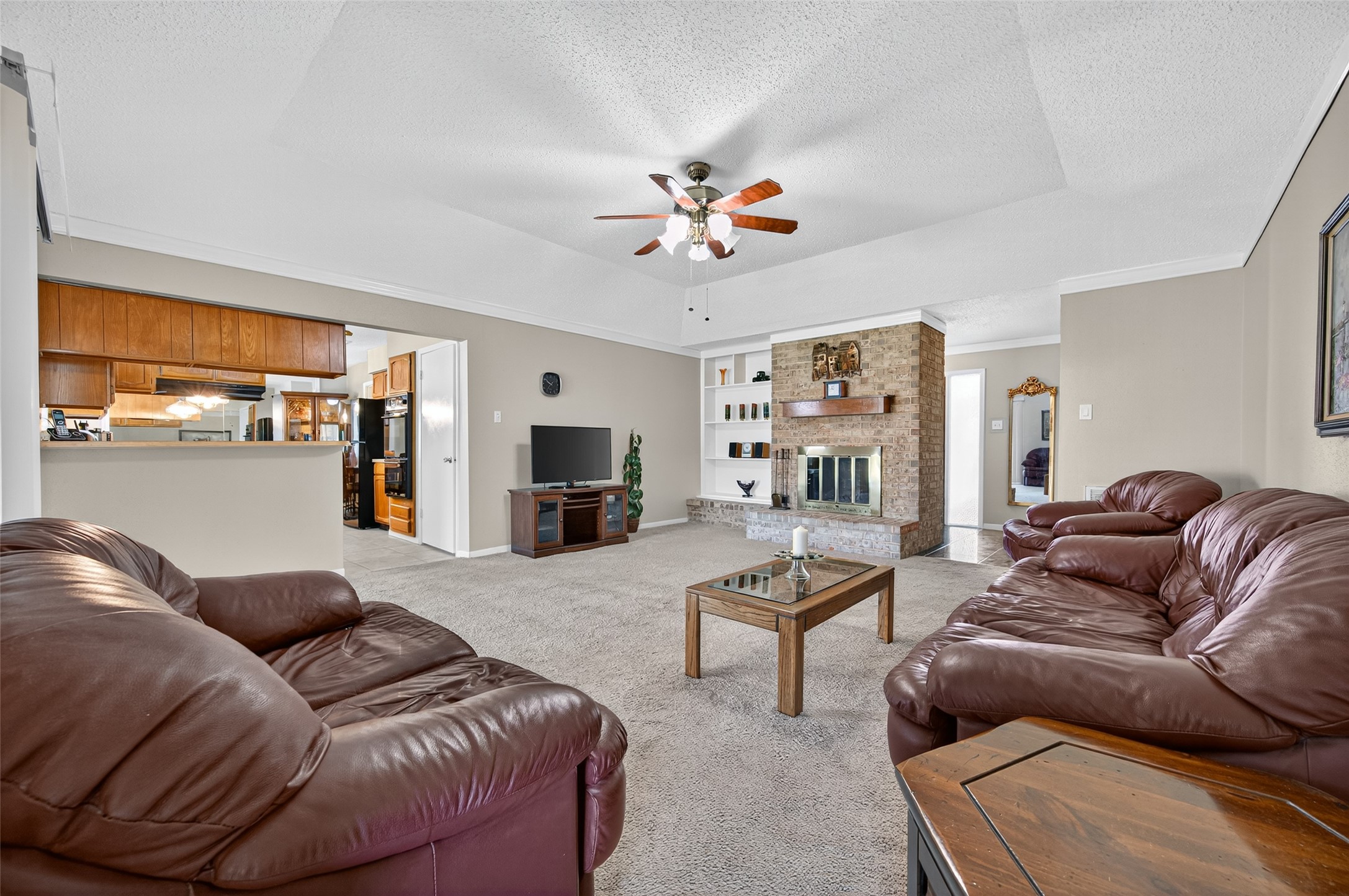 6230 Sunnygate Drive Spring, TX 77373 - Photo 10 of 40 a living room with furniture ceiling fan and a window