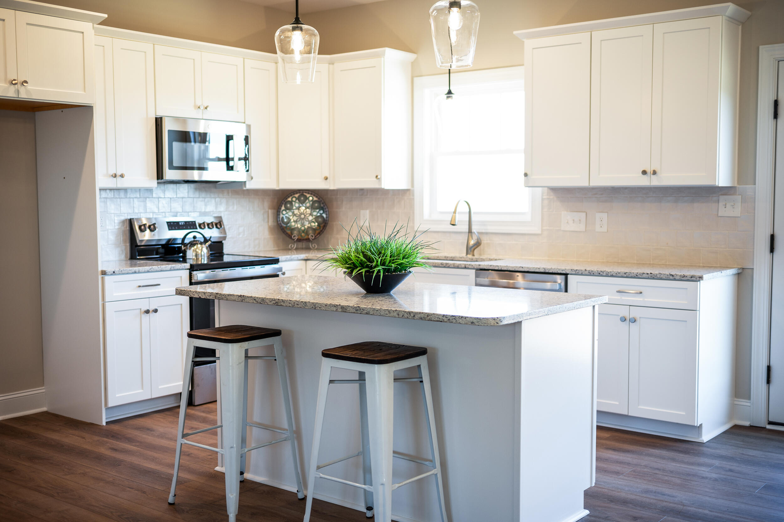 10510 Leesville Road Lynch Station, VA 24571 - Photo 13 of 60 a kitchen with stainless steel appliances granite countertop a white cabinets and a stove top oven
