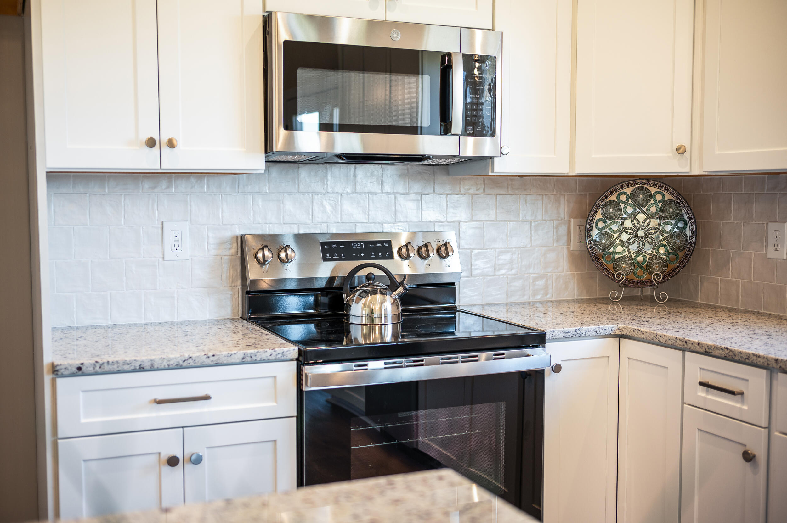 10510 Leesville Road Lynch Station, VA 24571 - Photo 14 of 60 a kitchen with granite countertop white cabinets and appliances