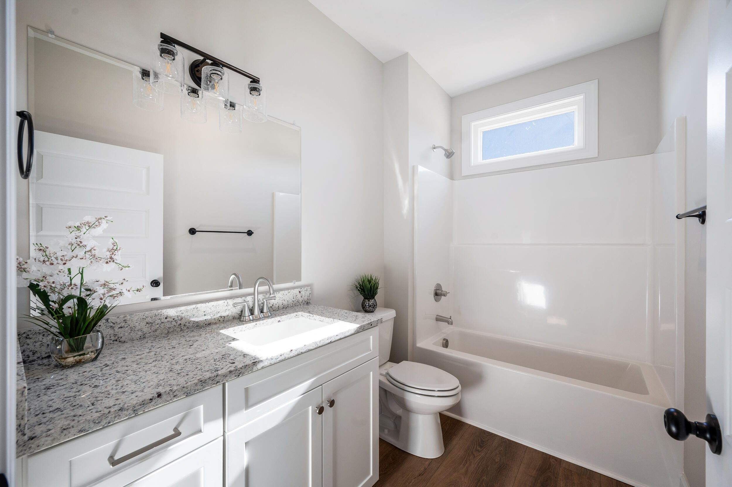 10510 Leesville Road Lynch Station, VA 24571 - Photo 38 of 60 a bathroom with a granite countertop sink a toilet and shower