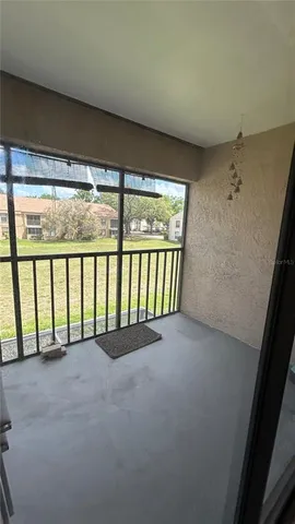 a view of an empty room with a balcony