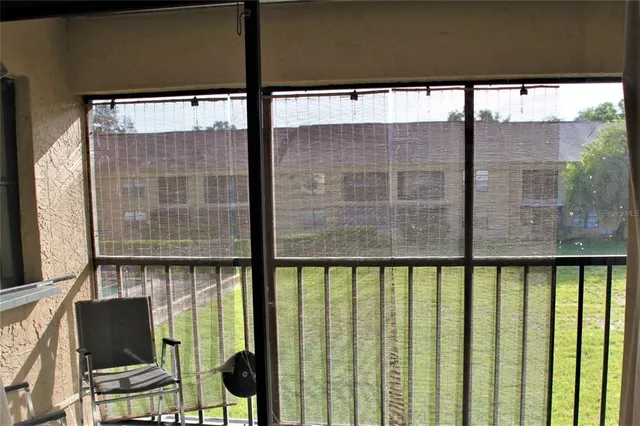 a view of a balcony with furniture