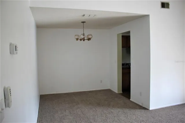 an empty room with a hallway