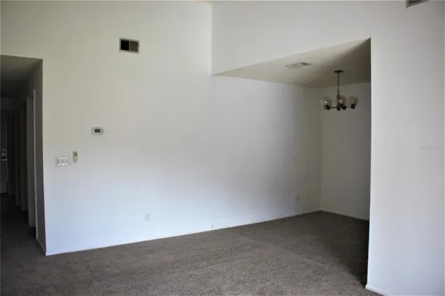 an empty room with a hallway