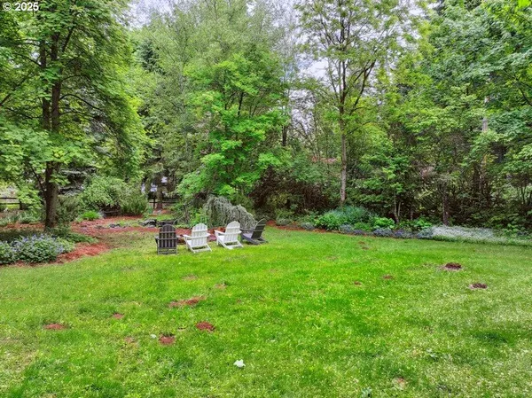 a backyard of a house with lots of green space