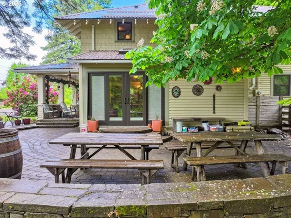 a front view of house with outdoor seating