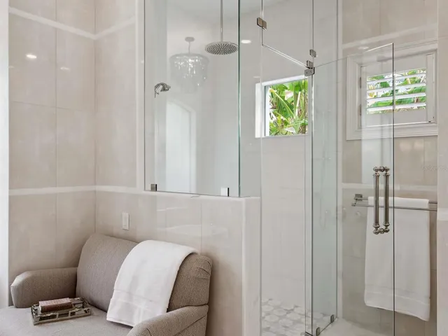 a bathroom with a tub and a shower