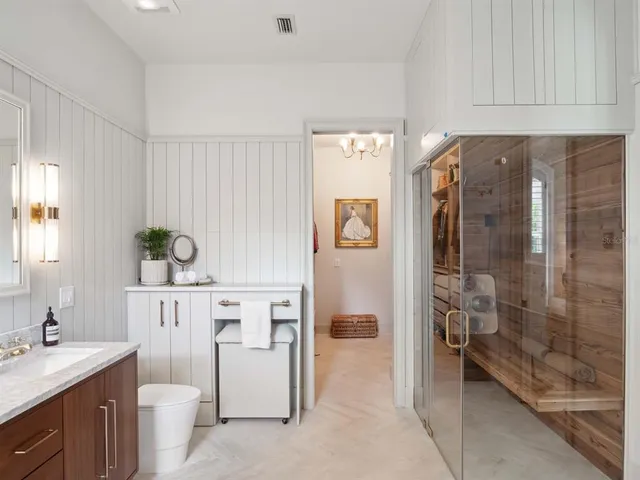 a utility room with cabinets washer and dryer