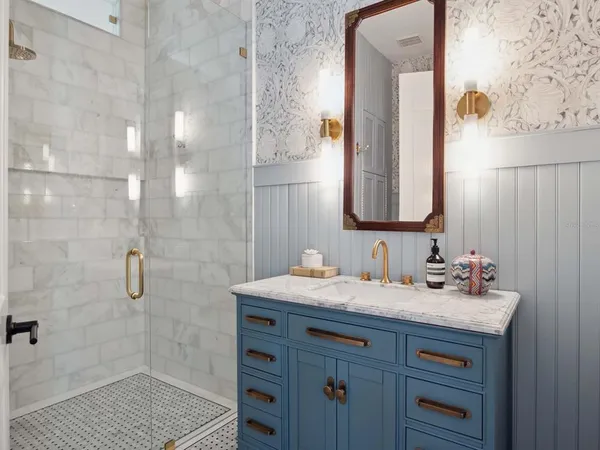 a bathroom with a sink and a mirror