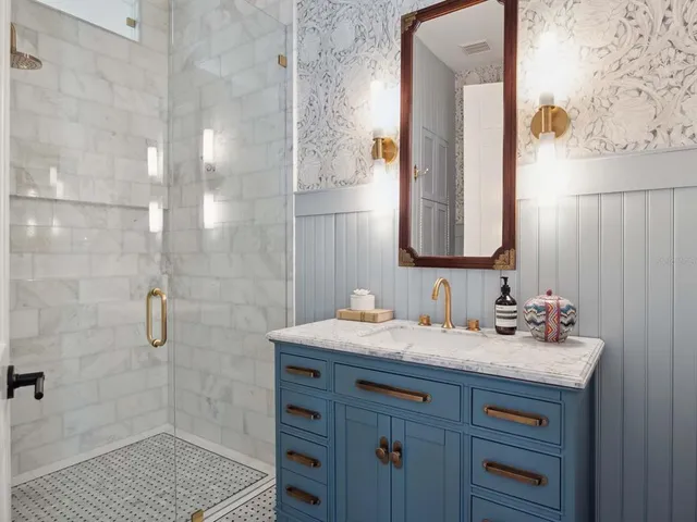 a bathroom with a sink and a mirror