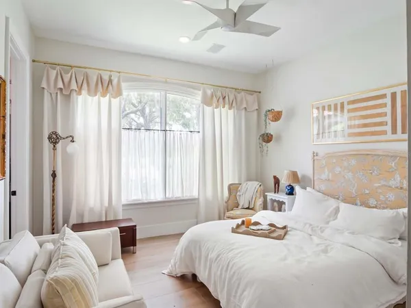 a bedroom with a bed and window
