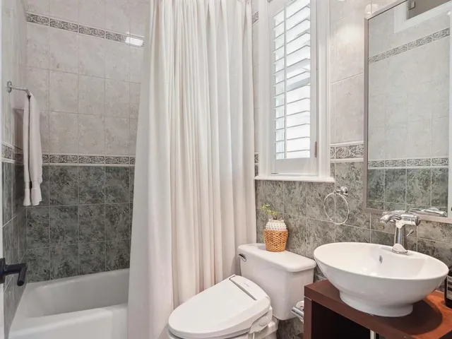 a bathroom with a toilet a sink and a bathtub