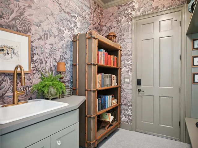 a kitchen with a cabinets and a book shelf