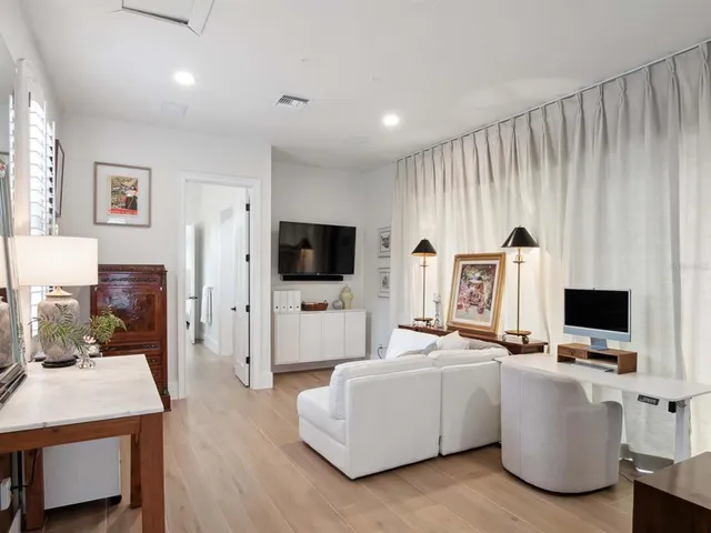 a kitchen with stainless steel appliances a stove a microwave and sink