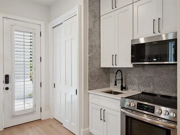 a bathroom with a sink double vanity and a mirror