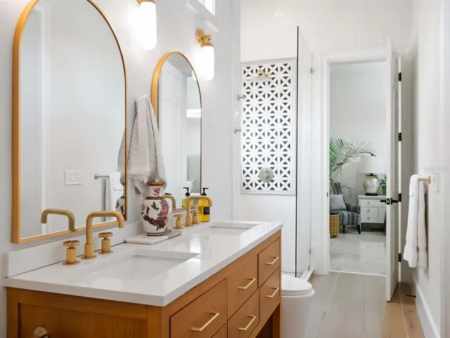 a bedroom with a bed and a potted plant