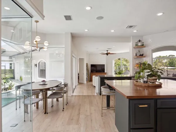 a kitchen with stainless steel appliances kitchen island granite countertop a sink and cabinets